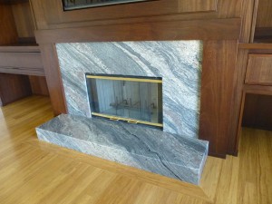 Mahogany fireplace surround with granite fireplace
